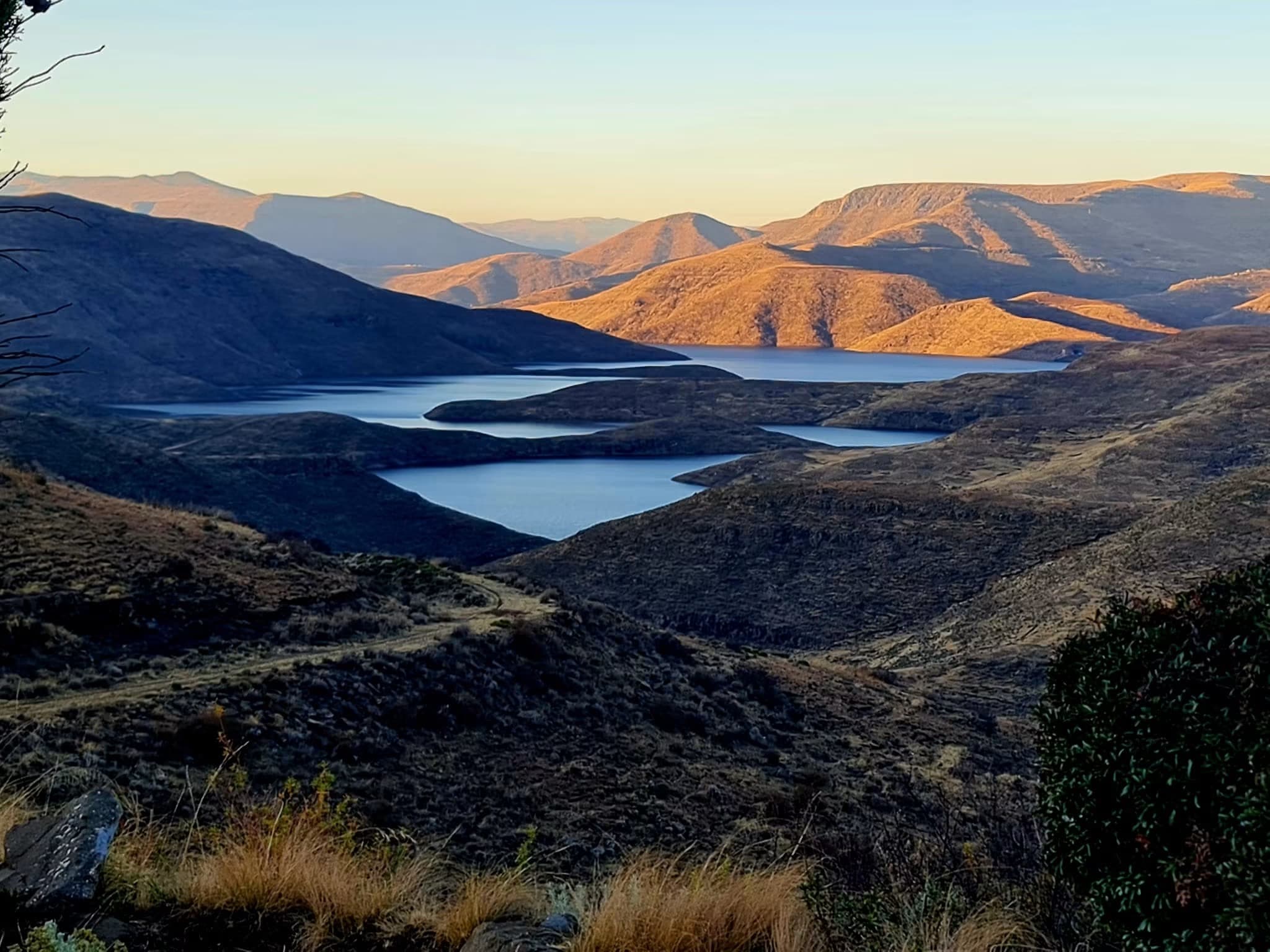Mohale Dam wall rising from the steep valley on the Senqunyane River