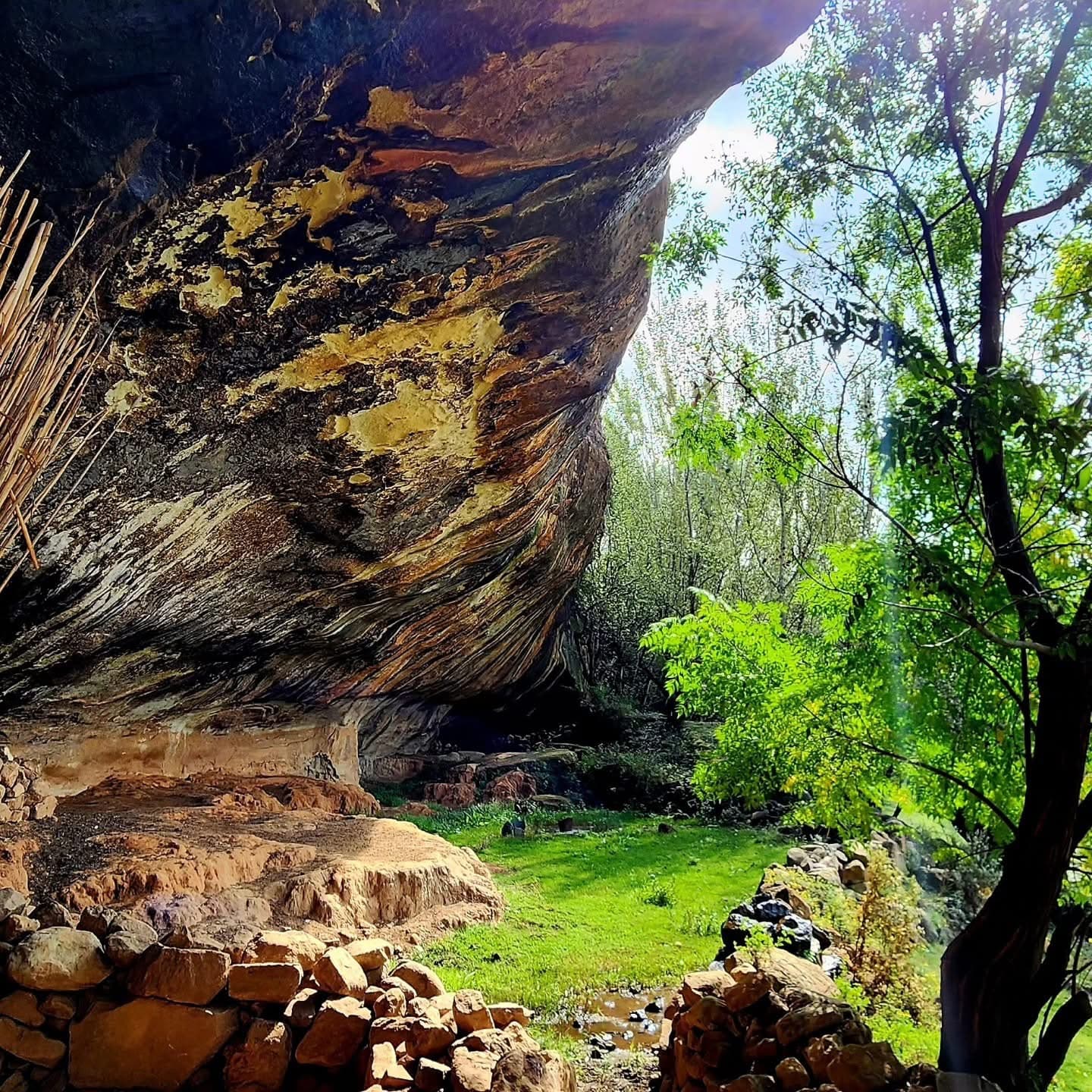 Sandstone cliff dwelling built into a rock overhang at Kome Caves, Lesotho