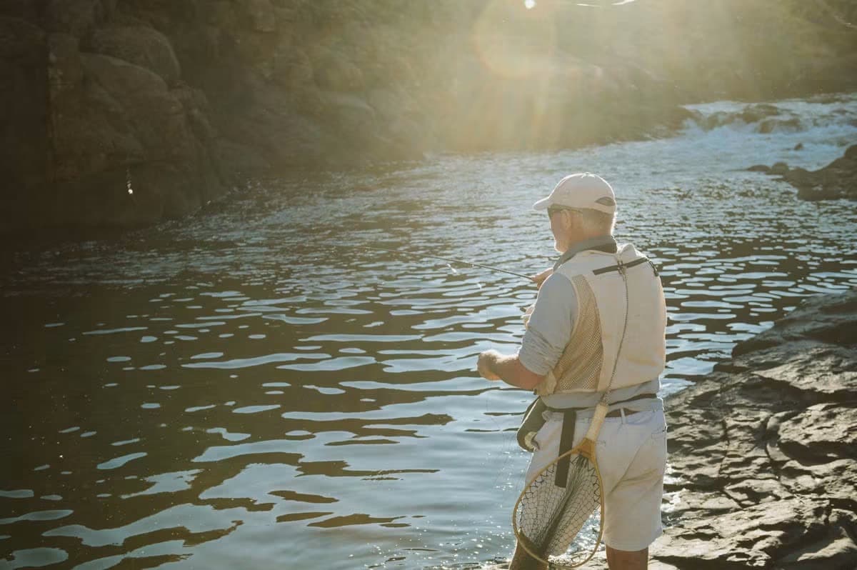 Angler fishing a clear mountain river in Lesotho